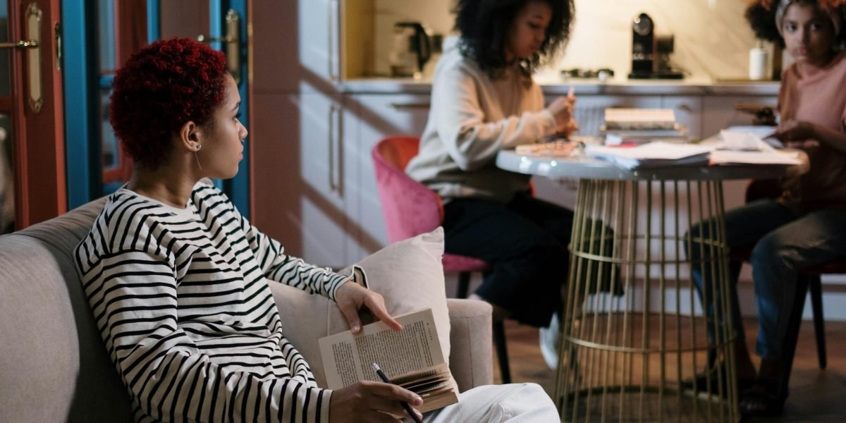 A diverse group of friends engaged in a passionate and lively book club discussion.