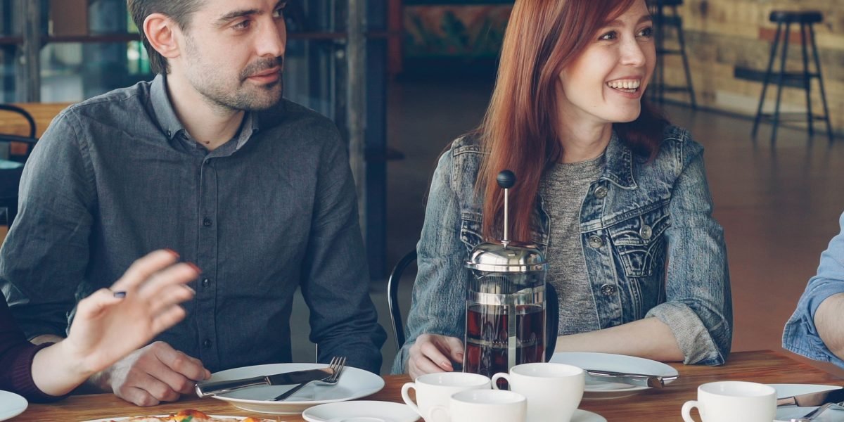 People in a relaxed setting, sharing personal experiences and connecting through conversation.