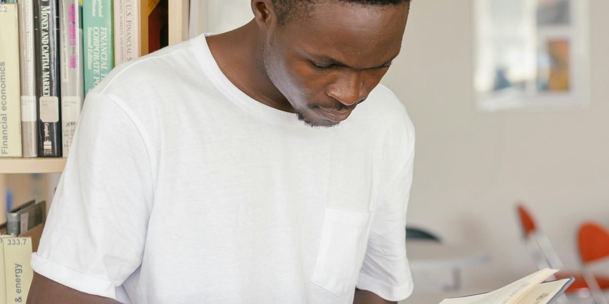 A person engrossed in reading, enjoying a book without the pressure of a costly purchase.