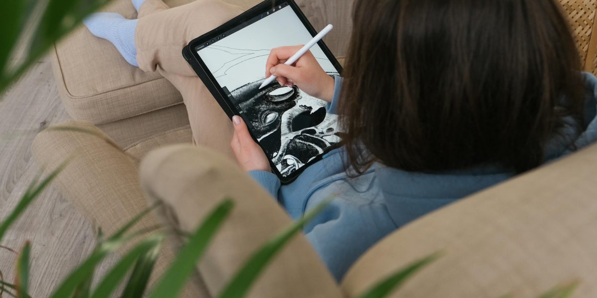A person comfortably reading on a tablet, symbolizing the convenience of library apps.
