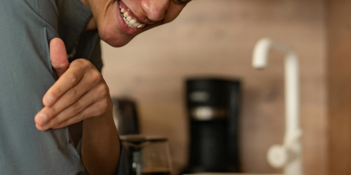 A person finds joy and connection through a humorous book, experiencing a moment of genuine laughter.