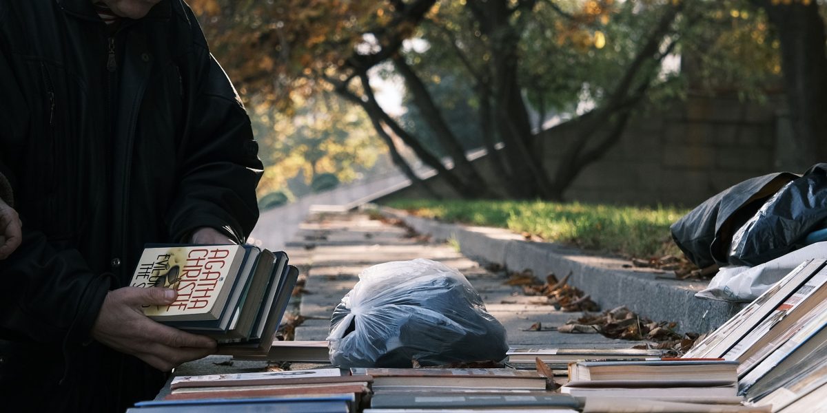 A knowledgeable bookseller guides a customer to their ideal humorous read, matching personal taste with curated selections.