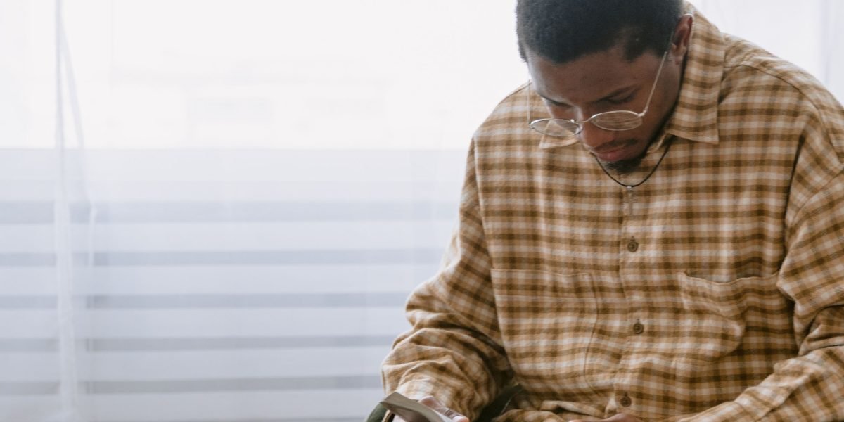 A reader enjoying a book, reflecting on its smart and warm humor.